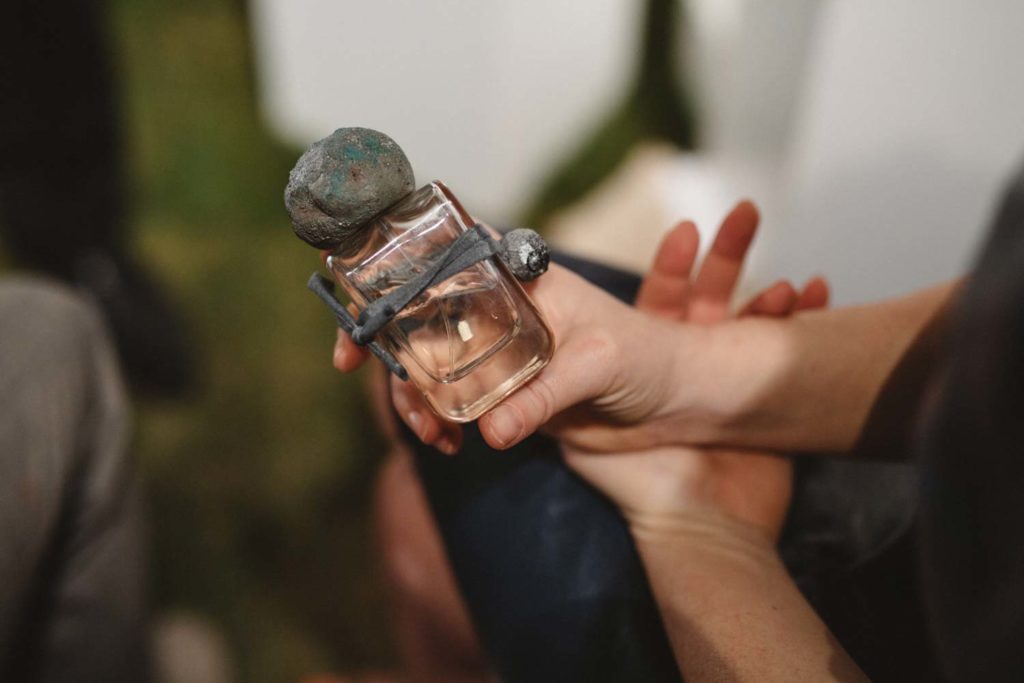 Sirio Extrait de Parfum flacon in glass bottle and hand sculpted cap and charm in Stefania Squeglia hands